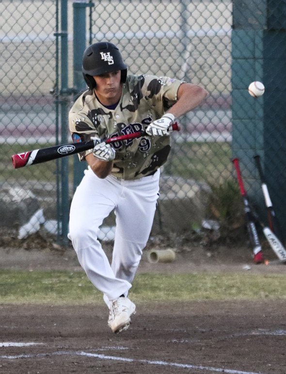 Jack Foote lays down a bunt in Thursday game against Mt. Whitney.
